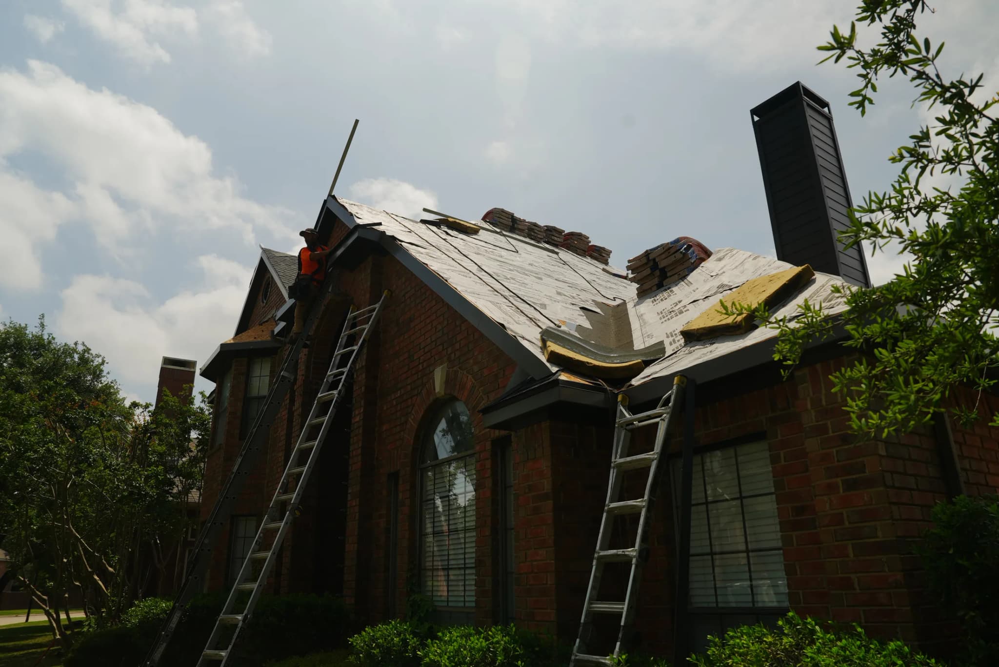 JRH crew on multi-ladder setup completing residential roof tear-off in Allen TX